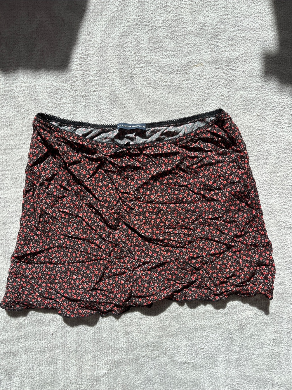 Brandy Melville Black Mini Skirt with Small Red Floral Print